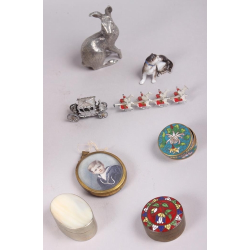 62 - A 19th century china model of a cat, a model of the Coronation coach, three pill boxes, a silver pla... 