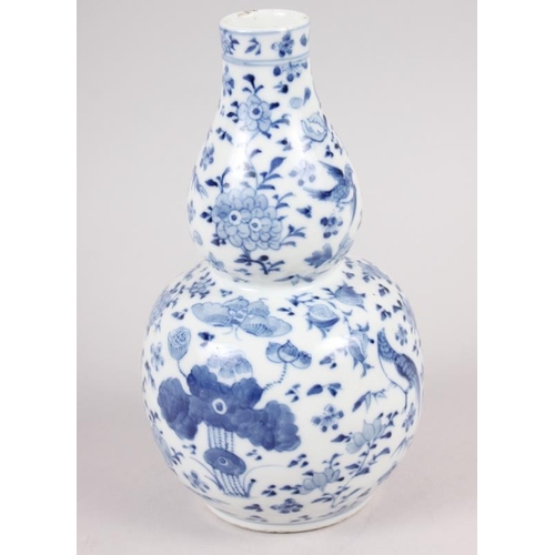 89 - A 19th century Chinese blue and white double gourd vase, decorated birds amongst foliage, 7