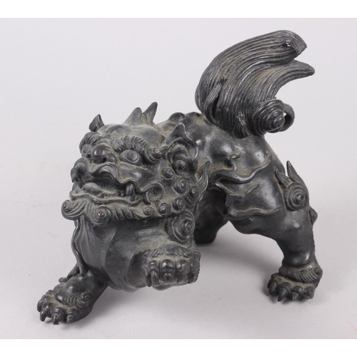 100 - A Chinese bronze model of a lion, 5 1/2