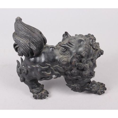 100 - A Chinese bronze model of a lion, 5 1/2