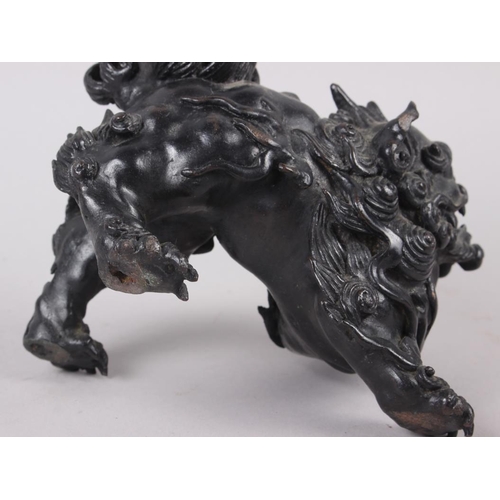 100 - A Chinese bronze model of a lion, 5 1/2