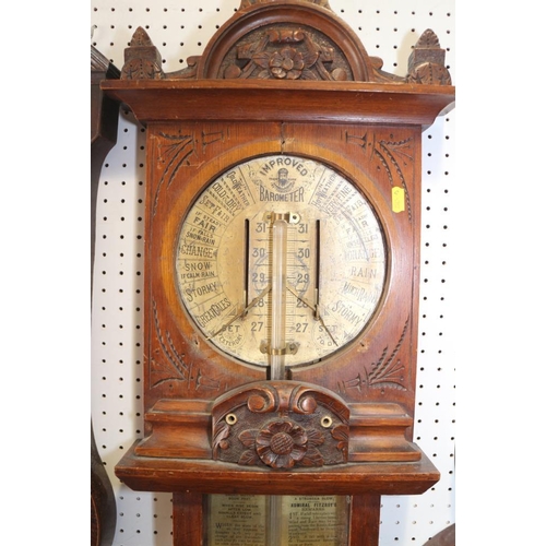 125 - An Admiral Fitzroy barometer, in carved wooden case, 44