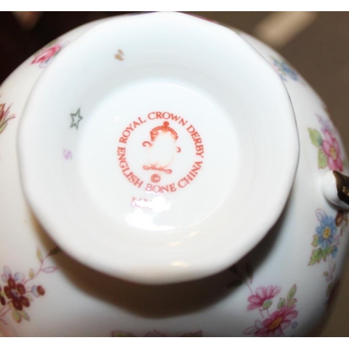 27 - A Royal Crown Derby part teaset, decorated floral sprays, a Royal Worcester porcelain blue and white... 