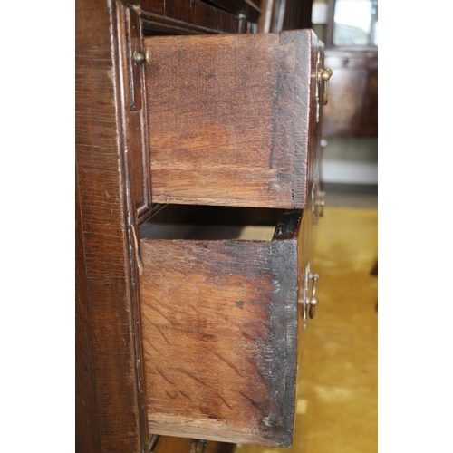 543 - An early 18th century crossbanded walnut bureau with stepped interior and two short and two long dra... 