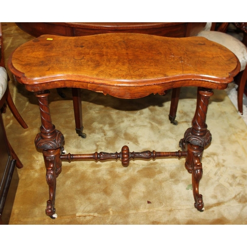 571 - A Victorian walnut rectangular occasional table, on turned and carved end supports