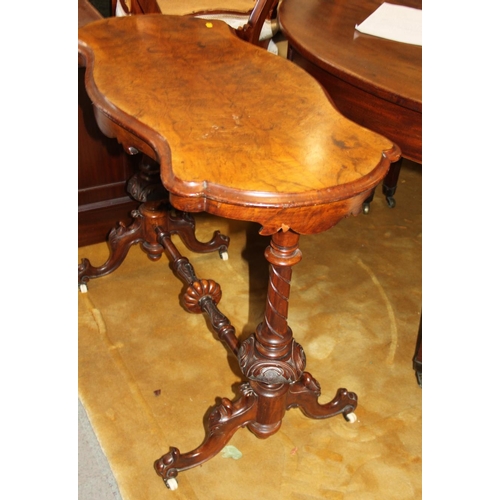 571 - A Victorian walnut rectangular occasional table, on turned and carved end supports