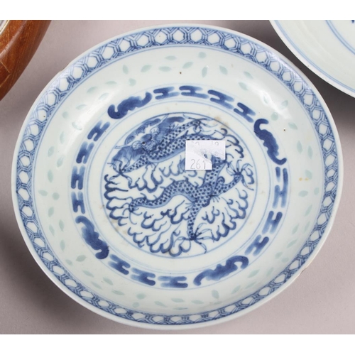 69 - Two Chinese blue and white dragon decorated dishes with six character marks to bases, similar plates... 