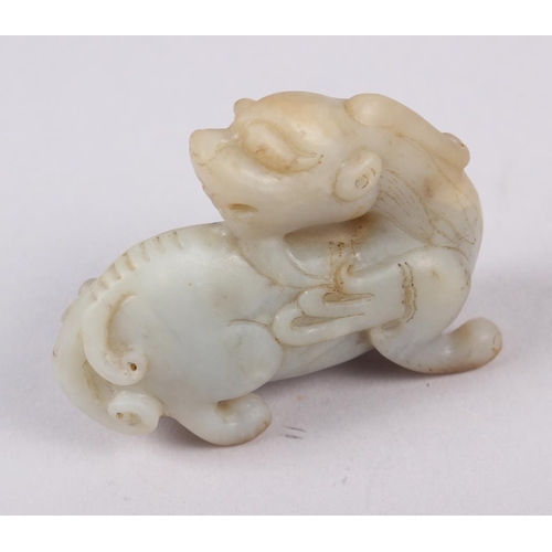 95 - A Chinese carved jade model of a dragon, on hardwood stand, 3 1/4