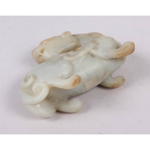 95 - A Chinese carved jade model of a dragon, on hardwood stand, 3 1/4