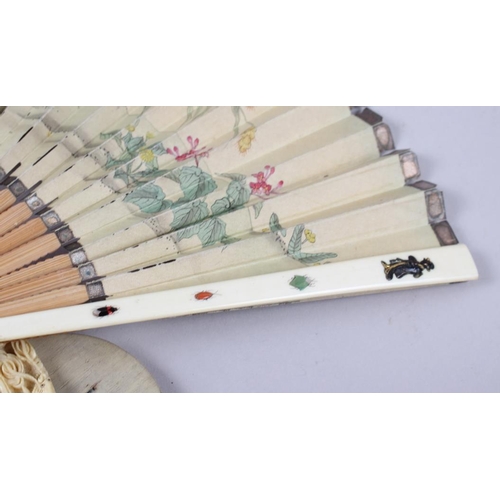 98 - A Shibayama fan and a carved ivory oval picture frame