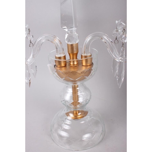 14 - A pair of two-branch glass candlesticks, hung drops with central spire finial, 15