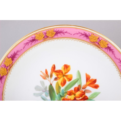 18 - A Continental porcelain dessert service with hand-painted floral decoration and pink and gilt border... 