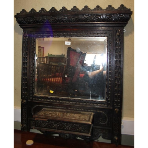 544 - A late 19th century wall mounted hallstand, in heavily carved frame, fitted mirror and glove box, 33... 