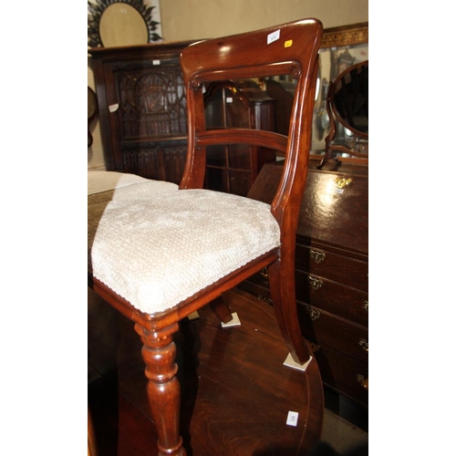 570 - A set of four 19th century mahogany dining chairs with plain top and back rails and stuffed over sea... 