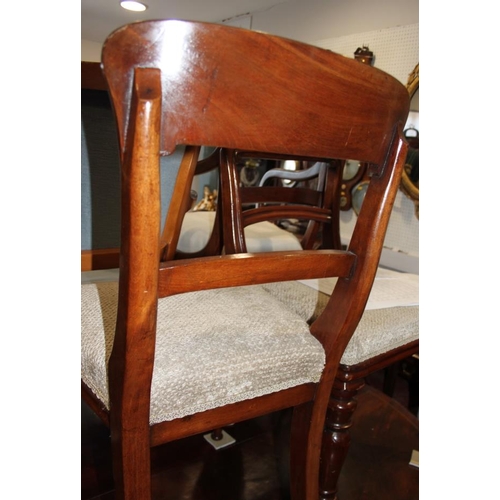 570 - A set of four 19th century mahogany dining chairs with plain top and back rails and stuffed over sea... 