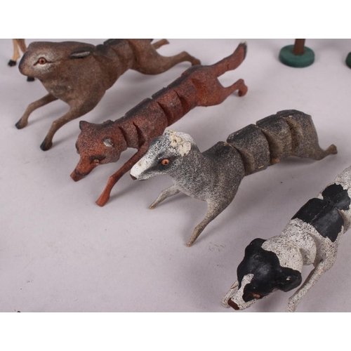 173 - A collection of carved wooden articulated animals (damages)