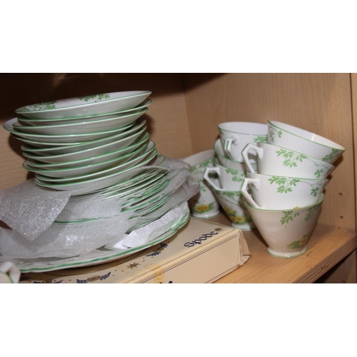 30 - A New Chelsea green floral part teaset and a Mortlock's green and gilt decorated part teaset