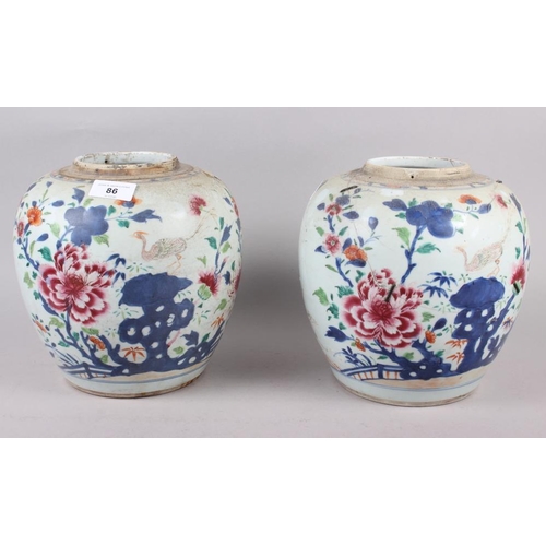 86 - A pair of 19th century porcelain ginger jars, decorated flowering bushes, 9