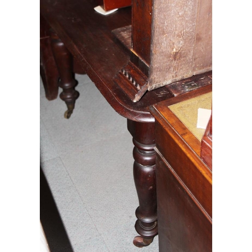 519 - A 19th century mahogany extending dining table with centre leaf and winding handle, on turned suppor... 