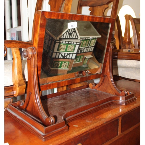 582 - A 19th century mahogany swing frame toilet mirror, on scroll standards and tray base, 20