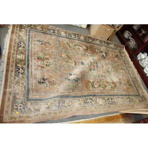 736 - A Chinese silk carpet decorated thirteen floral panels on a beige ground and main floral border stri... 