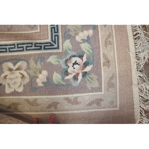 736 - A Chinese silk carpet decorated thirteen floral panels on a beige ground and main floral border stri... 