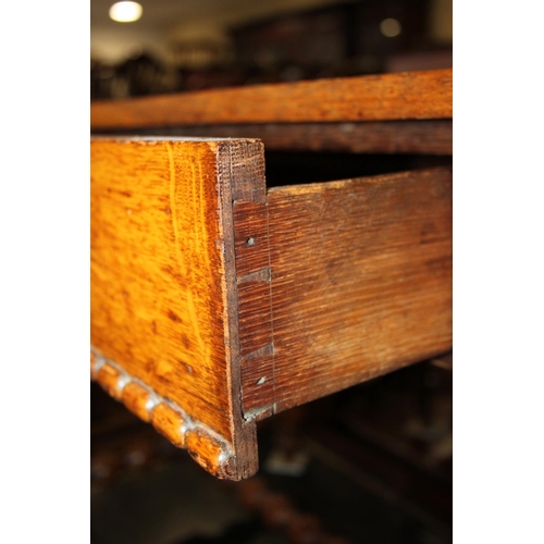 551 - A 19th century oak side table, fitted frieze drawer, on bobbin turned supports, 36