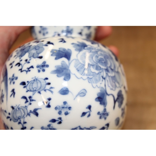 89 - A 19th century Chinese blue and white double gourd vase, decorated birds amongst foliage, 7