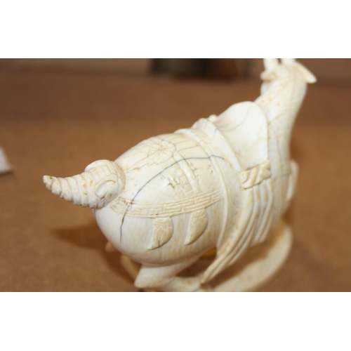 97 - A number of carved ivory Emperor's horses, one on hardwood stand