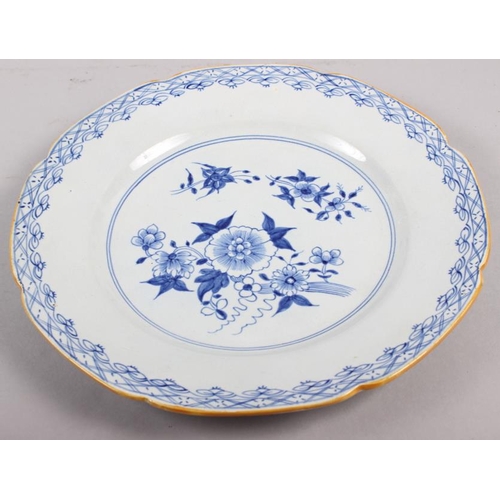 10 - A Rockingham china floral decorated and gilt plate, two Brameld blue and white floral decorated plat... 