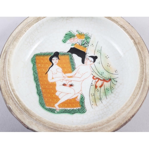 111 - A Chinese porcelain circular box with white metal mounts and erotic decoration to the interior, 4 1/... 