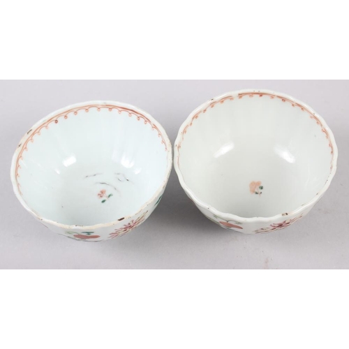 114 - A set of four Chinese tea bowls with floral and scroll decoration, and three matching dishes (chips ... 