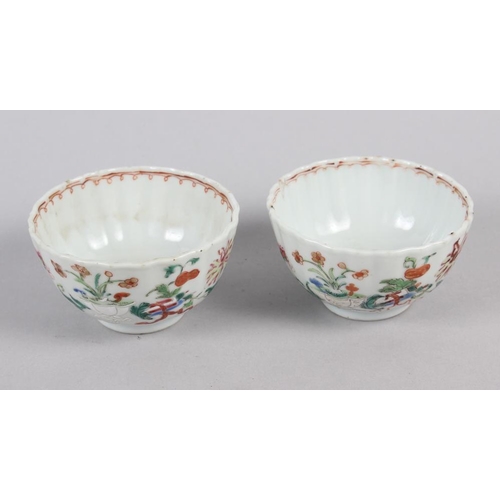 114 - A set of four Chinese tea bowls with floral and scroll decoration, and three matching dishes (chips ... 