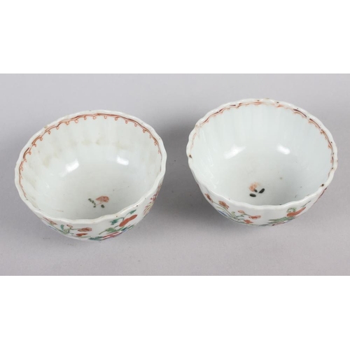 114 - A set of four Chinese tea bowls with floral and scroll decoration, and three matching dishes (chips ... 