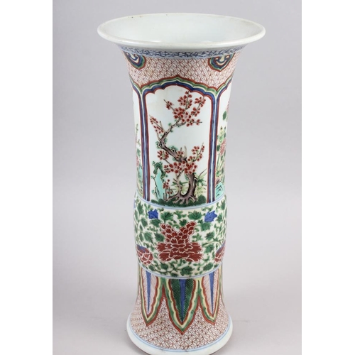 115 - A Chinese gu vase with panels decorated trees and flowers, 16 1/2