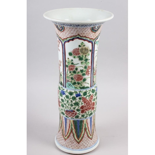 115 - A Chinese gu vase with panels decorated trees and flowers, 16 1/2