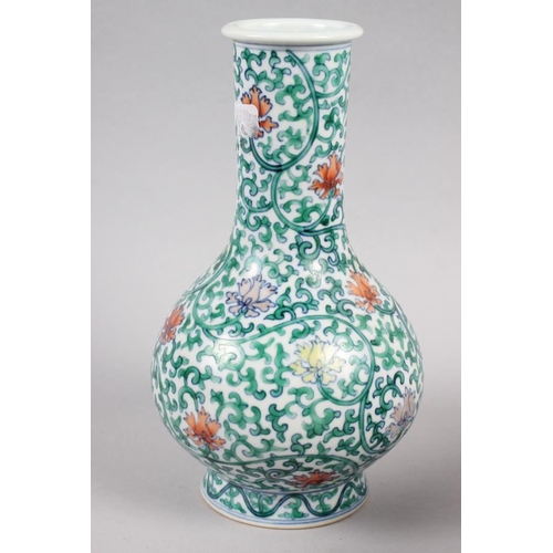 121 - A Chinese bulbous vase with vine and floral decoration, 8