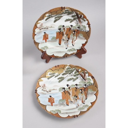 124 - A pair of Chinese plates, decorated monkeys in a landscape with character marks to base, 10 1/4