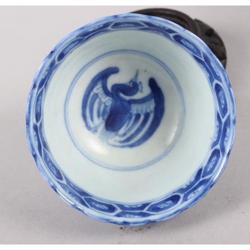 126 - A pair of Chinese blue and white tea bowls, decorated dragons and phoenix with four character marks ... 