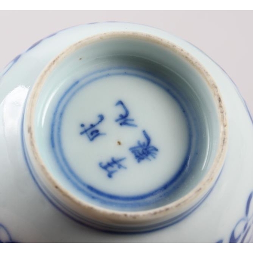 126 - A pair of Chinese blue and white tea bowls, decorated dragons and phoenix with four character marks ... 