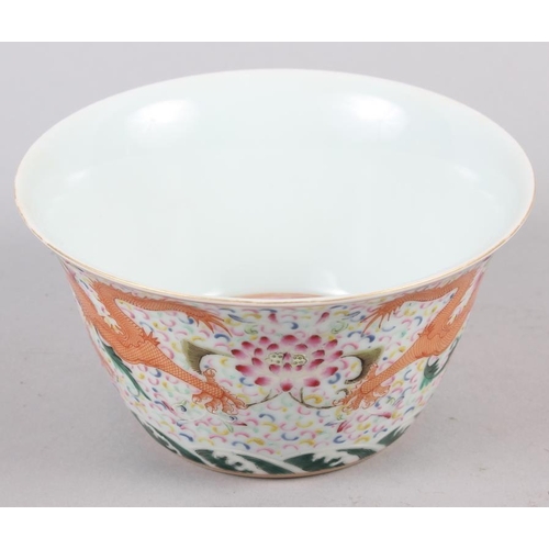 133 - A Chinese bowl with flared rim, decorated dragons and flowers with seal mark to base