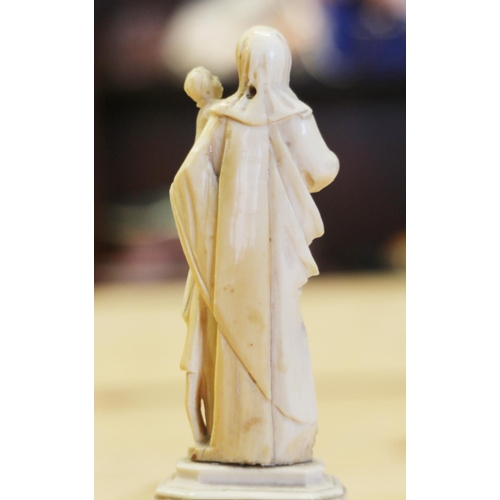 141 - A 19th century Dieppe ivory of the Madonna and child, on circular column and square base, 6