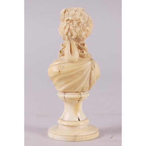 142 - A 19th century carved ivory portrait bust of Marie Antoinette, on turned column, 4 3/4