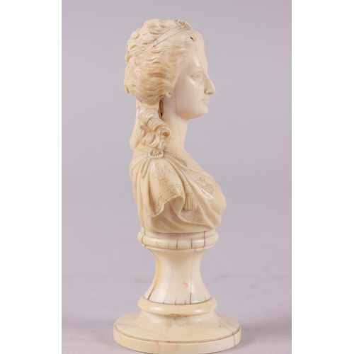 142 - A 19th century carved ivory portrait bust of Marie Antoinette, on turned column, 4 3/4