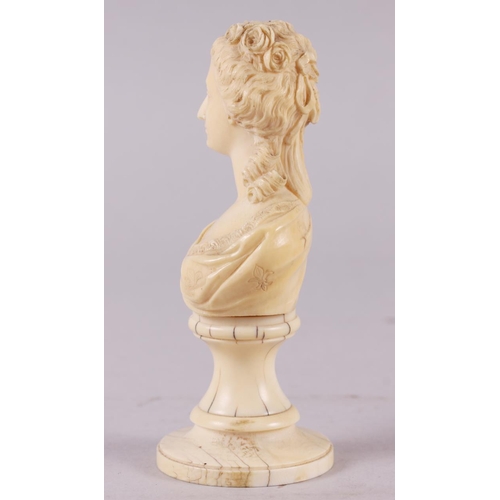 142 - A 19th century carved ivory portrait bust of Marie Antoinette, on turned column, 4 3/4