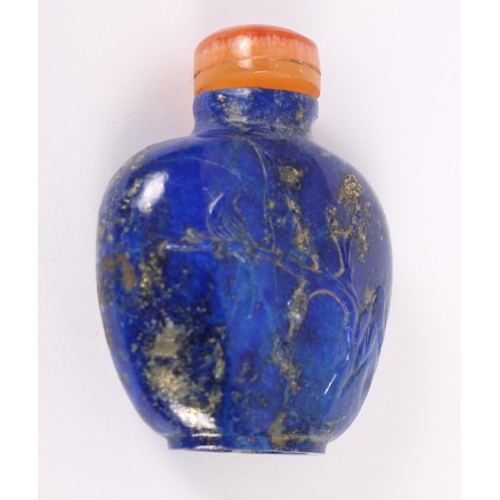 153 - A Chinese carved lapis lazuli snuff bottle, decorated with a bird on a branch to one side and figure... 