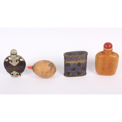 156 - A Chinese cloisonne enamel oblong box and cover, a Chinese snuff bottle formed from a nut, decorated... 