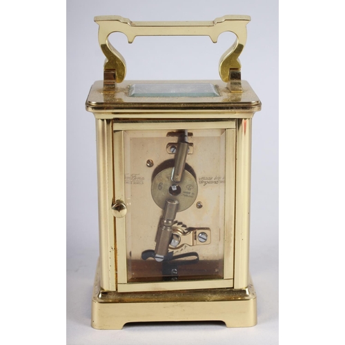 160 - A brass cased carriage clock by H Samuel