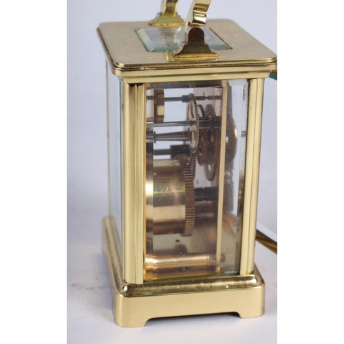 160 - A brass cased carriage clock by H Samuel