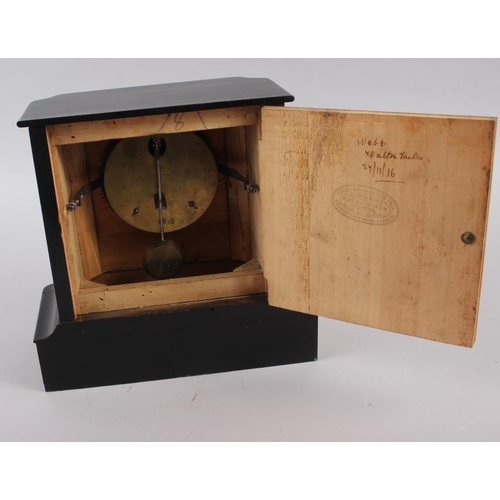 185 - A mahogany and ebonised cased mantel clock with white enamel dial and Roman numerals, 8 1/2